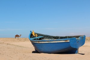 A ship of the desert and a beached boat at Tifnit