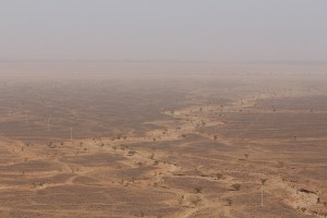 Desert as far as you can see through the dust clouds