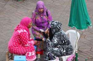 Henna tattooists waiting for a client