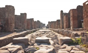 Deep grooves show the wagon tracks. Large stepping stones sit above the ruuning open sewers that were the streets of Pompeii