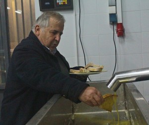 The Olive King inspecting the final product