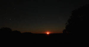A blood red moon rise over the Tanami